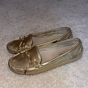 Micheal Kors gold flats